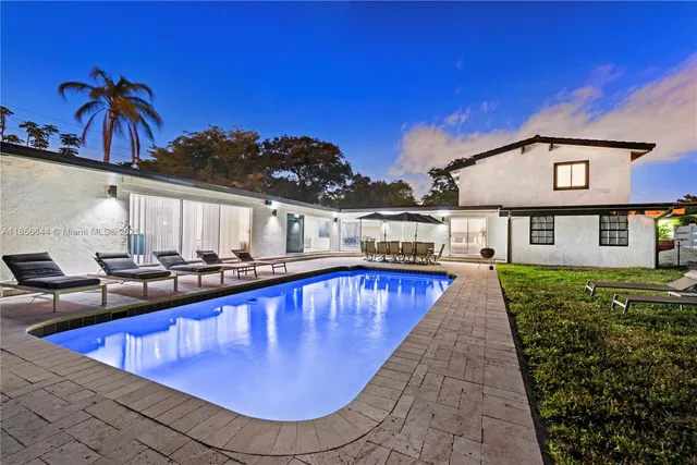 a view of a swimming pool with a patio