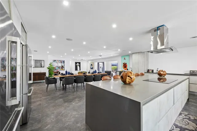 a view of a kitchen and dining room