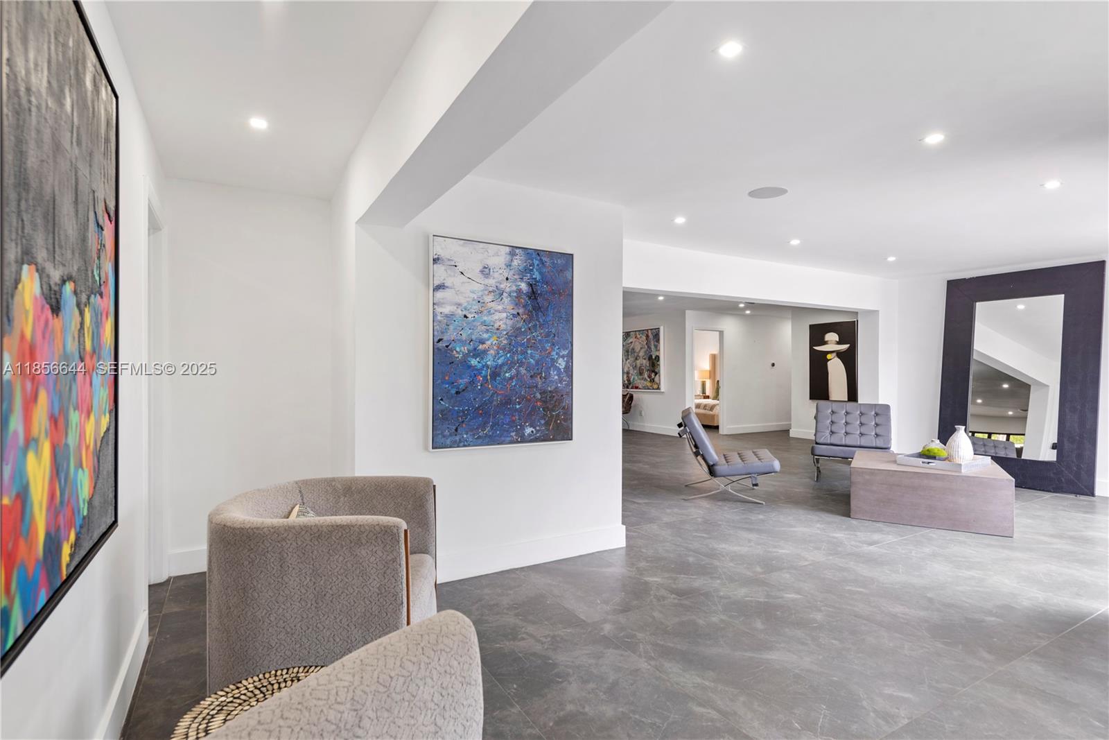 4322 Polk Street Hollywood, FL 33021 - Photo 14 of 43 a living room with furniture and a flat screen tv