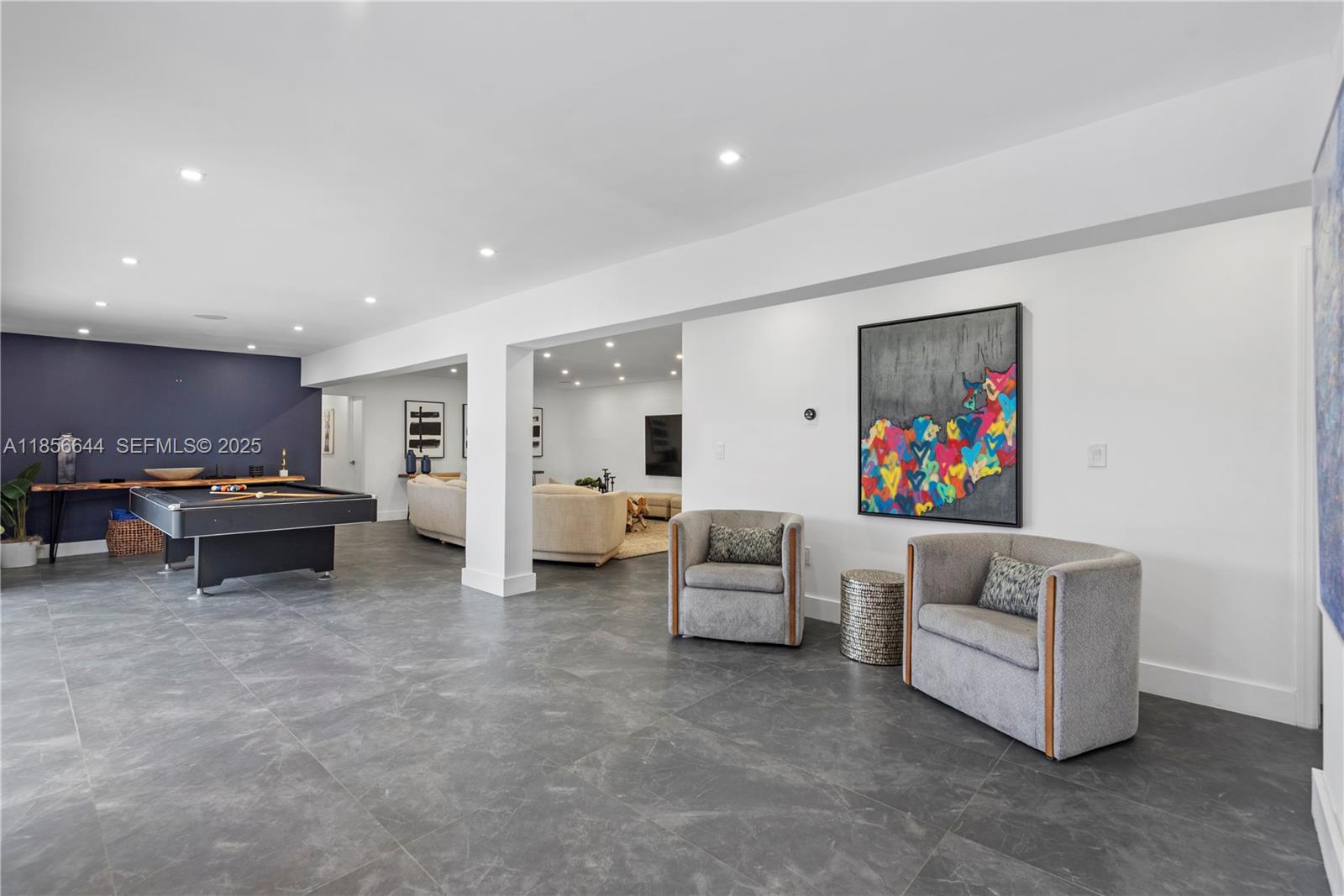 4322 Polk Street Hollywood, FL 33021 - Photo 15 of 43 a living room with furniture and a flat screen tv