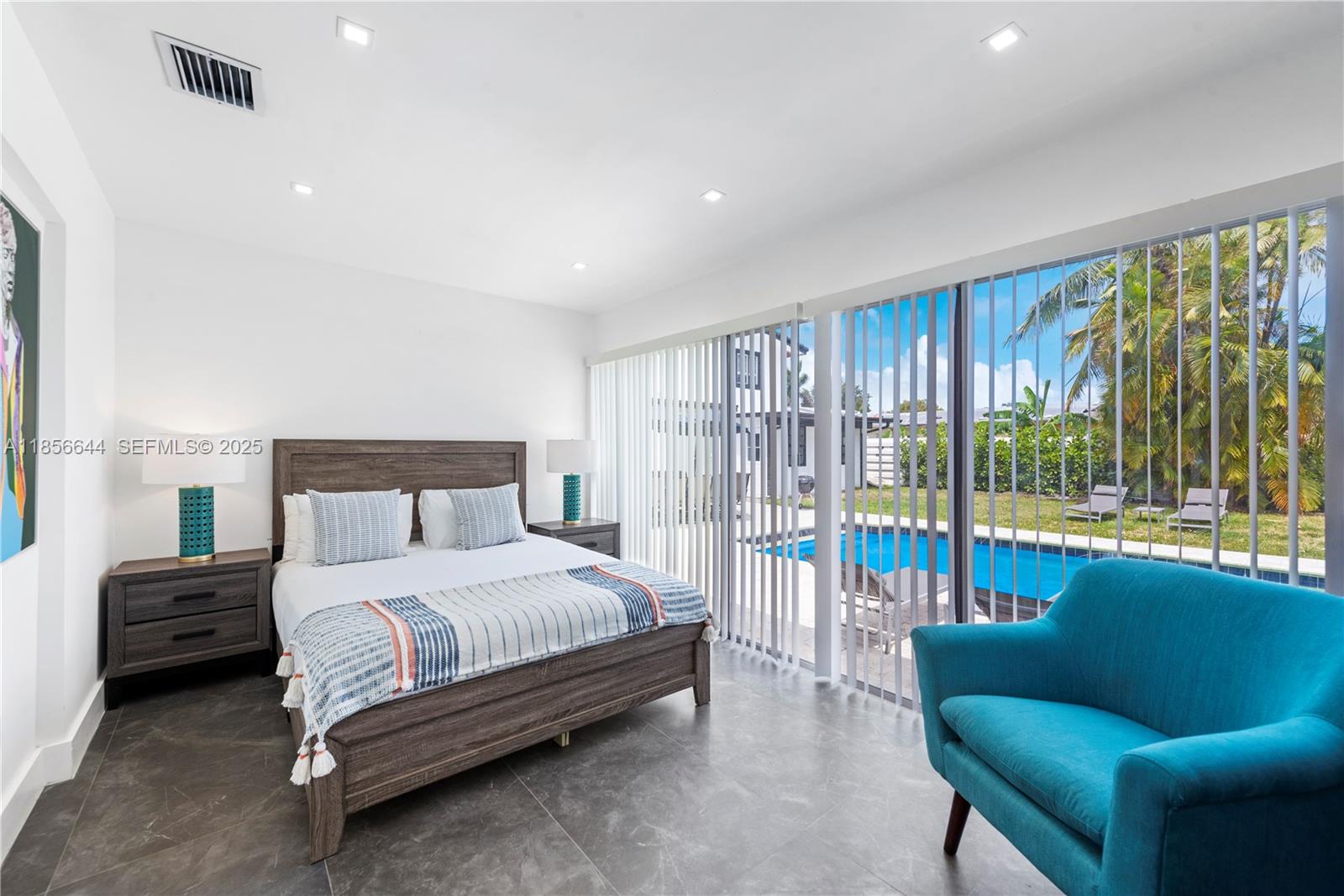 4322 Polk Street Hollywood, FL 33021 - Photo 22 of 43 a bedroom with a bed and a couch