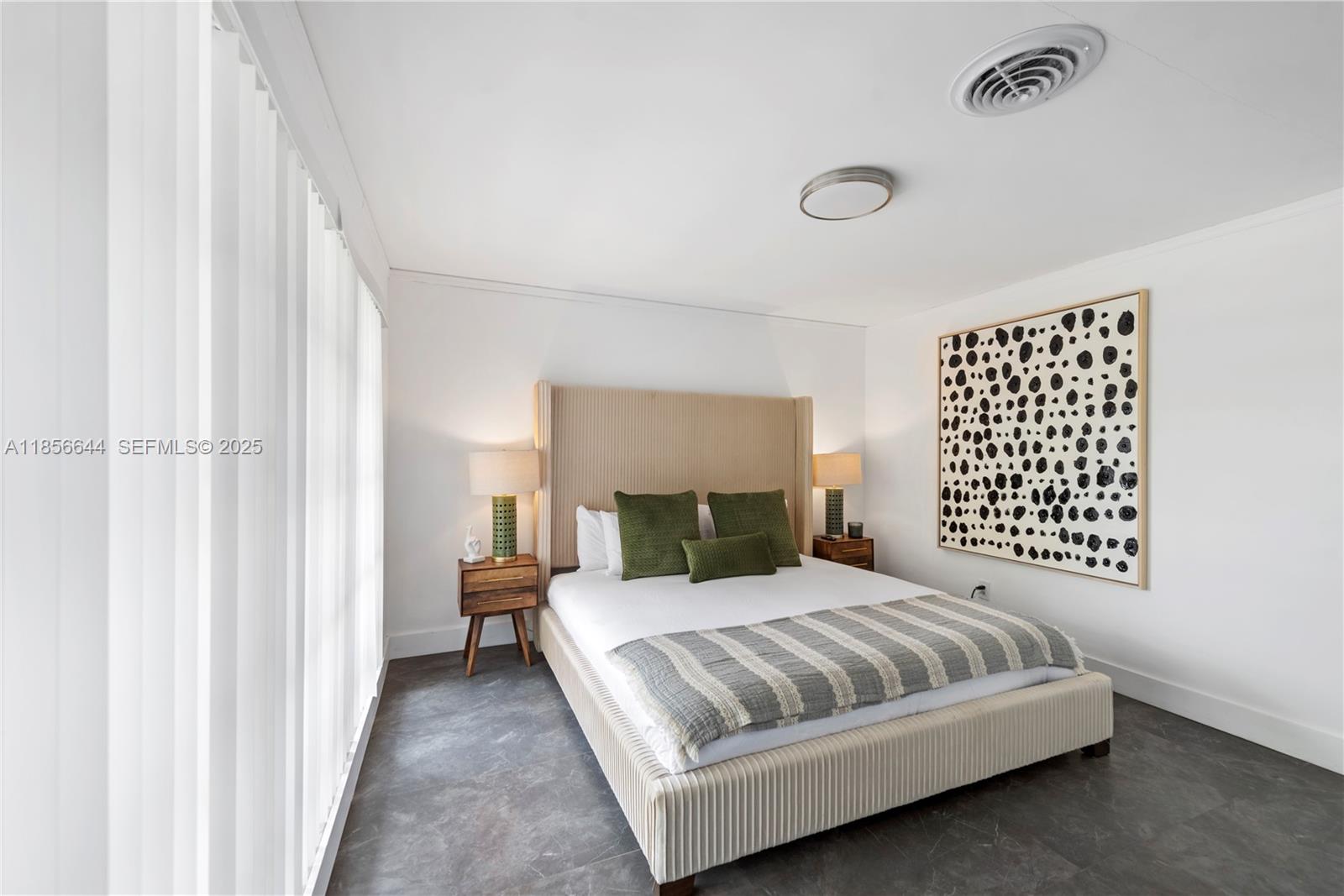 4322 Polk Street Hollywood, FL 33021 - Photo 26 of 43 a bedroom with a bed and a night stand