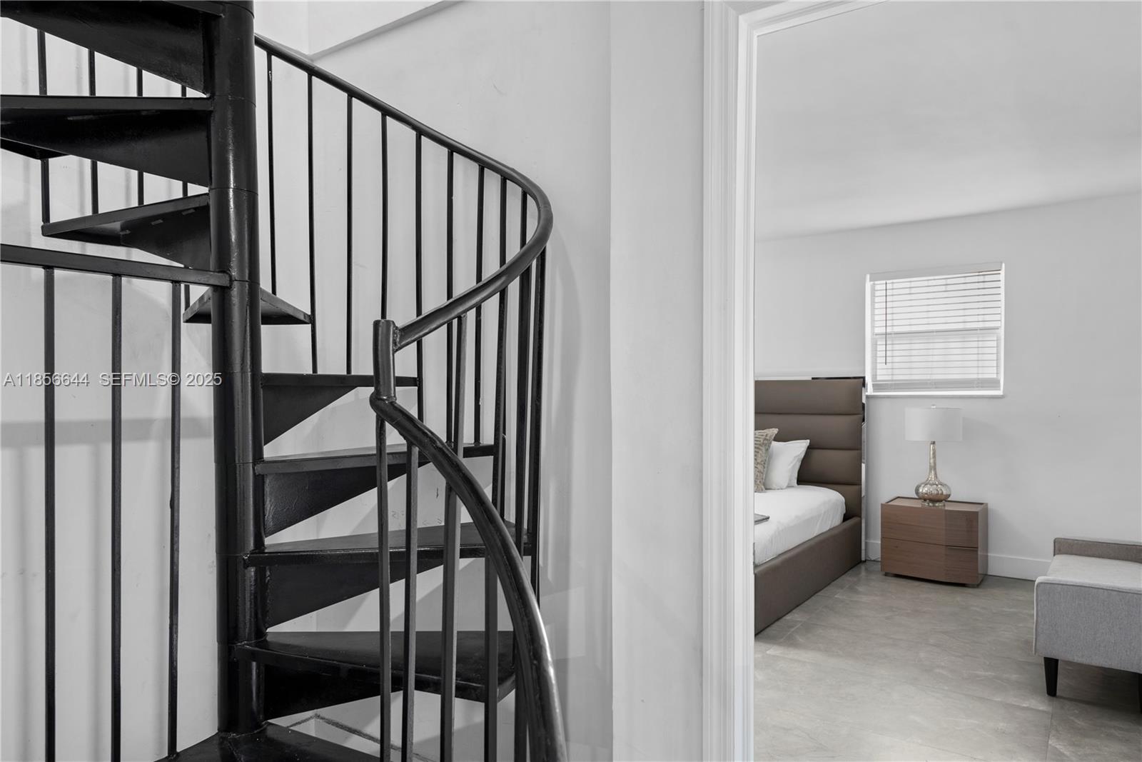 4322 Polk Street Hollywood, FL 33021 - Photo 31 of 43 a view of a hallway with wooden floor and stairs