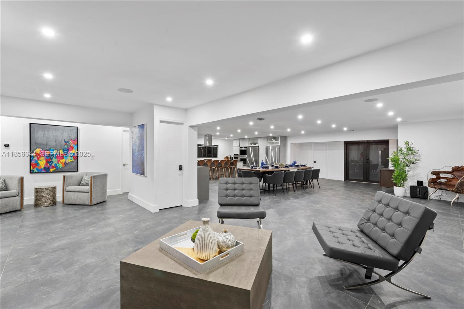 4322 Polk Street Hollywood, FL 33021 - Photo 37 of 43 a living room with furniture and a flat screen tv