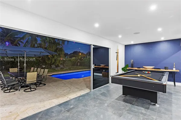 a swimming pool with outdoor seating