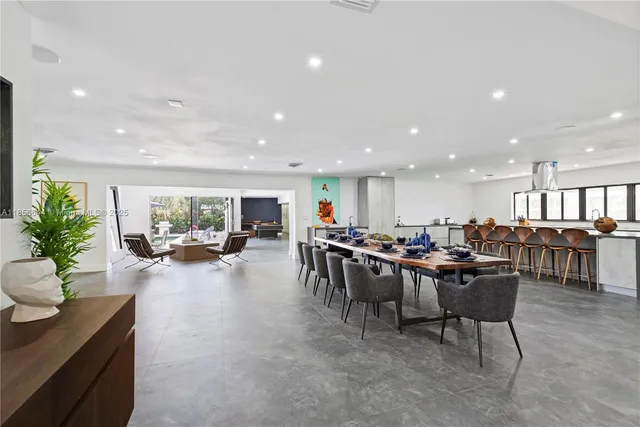 a room with lots of furniture and a living room