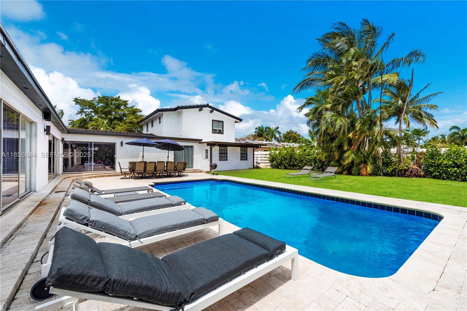 4322 Polk Street Hollywood, FL 33021 - Photo 42 of 43 a view of house with yard entertaining space and outdoor seating