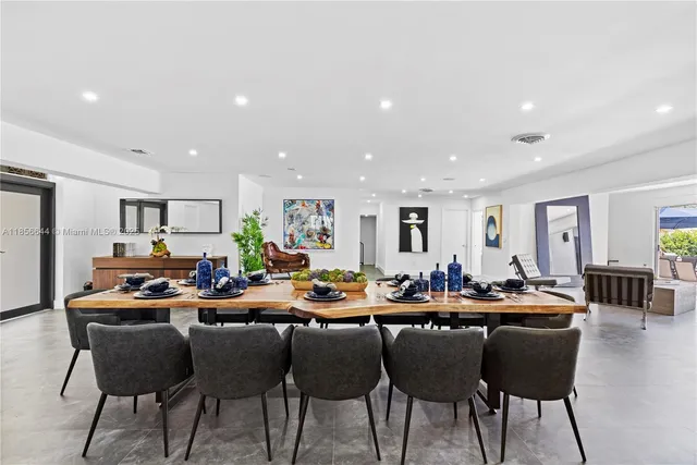 a view of kitchen with breakfast area and windows