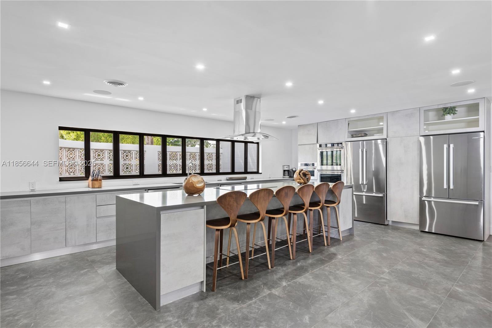 4322 Polk Street Hollywood, FL 33021 - Photo 9 of 43 a large kitchen with lots of counter space and windows