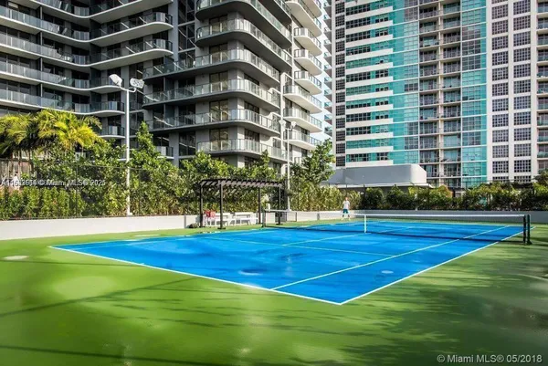 a view of a swimming pool with an outdoor space and seating area