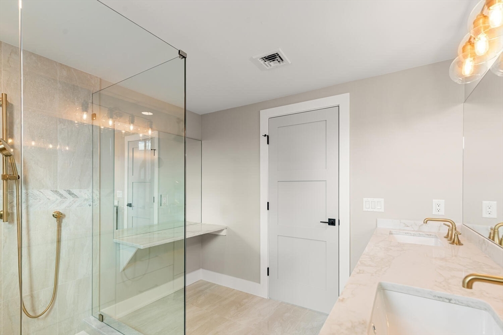 308 Newton Street, Unit 1F Waltham, MA 02453 - Photo 20 of 23 a bathroom with a shower and a sink