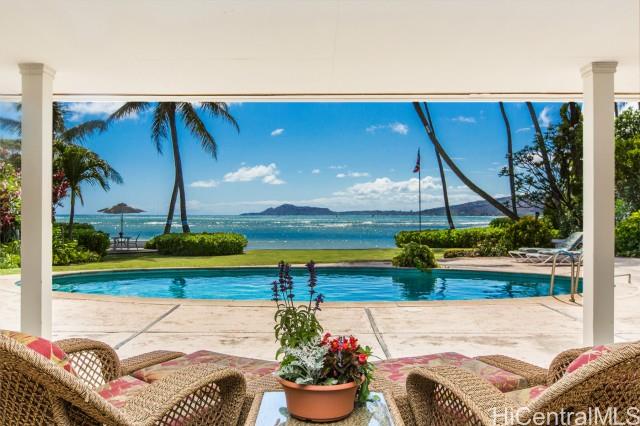 435 Portlock Road Honolulu, HI 96825 - Photo 1 of 1 a view of swimming pool with seating space and yard