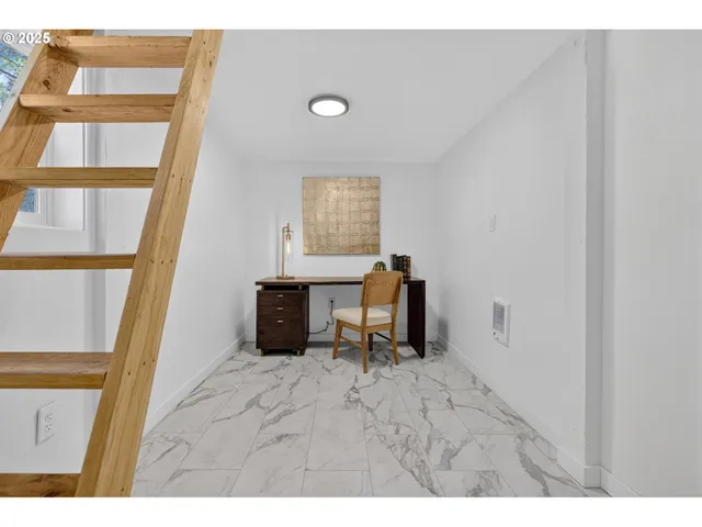 a workspace with furniture and window