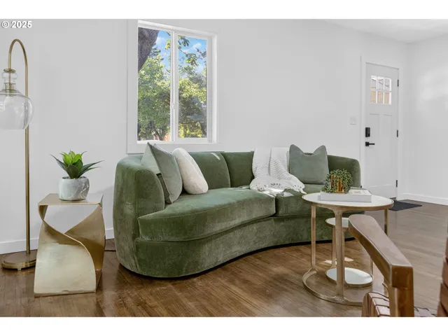 a living room with furniture and a table