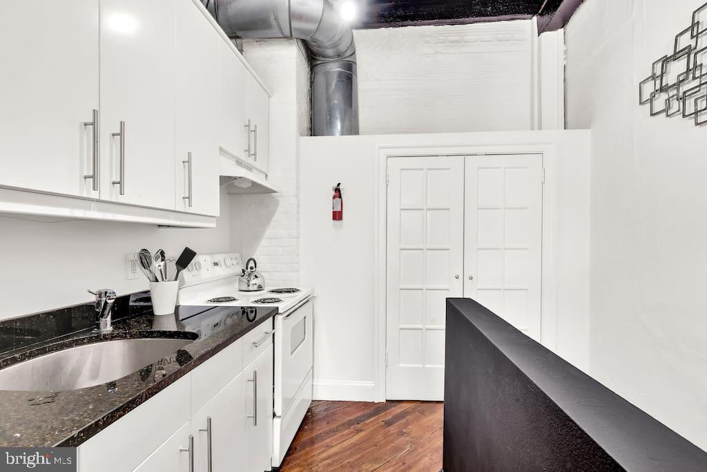 216 West Rittenhouse Street Philadelphia, PA 19144 - Photo 6 of 9 a kitchen with granite countertop a sink and cabinets