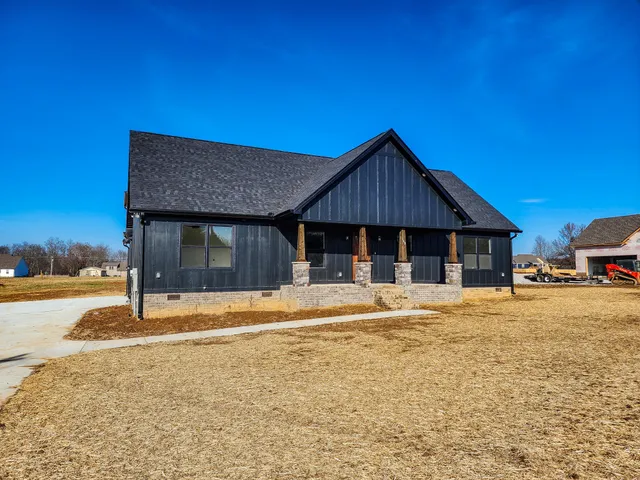 a house with trees in the background