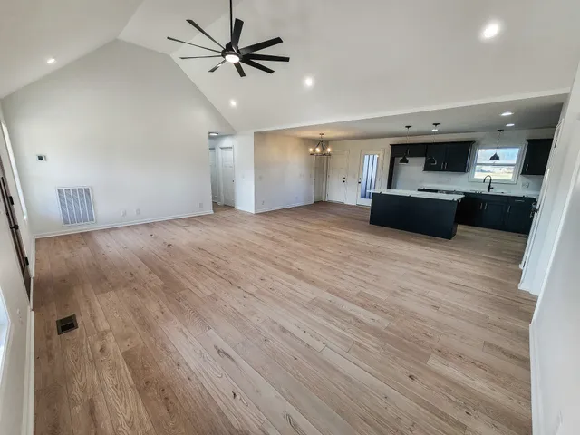 a view of a kitchen with a sink and a microwave