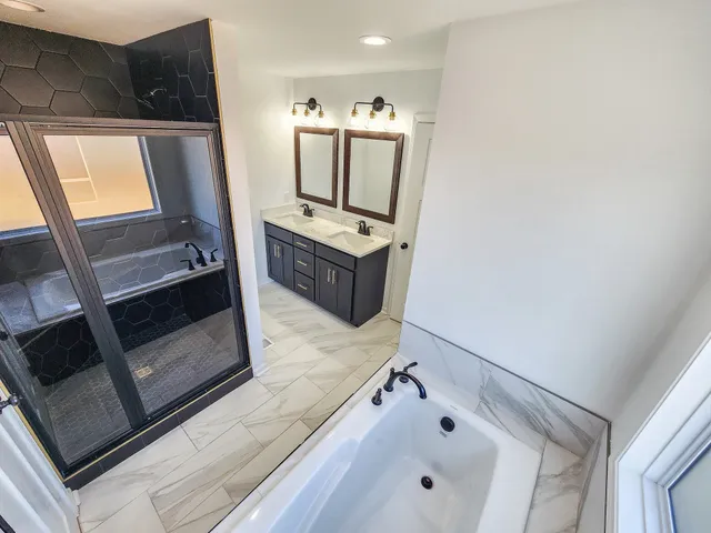 a view of a living room with a flat screen tv and a fireplace