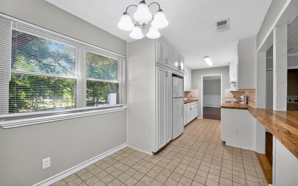 220 Short Street Burleson, TX 76028 - Photo 16 of 36 a view of a kitchen with windows