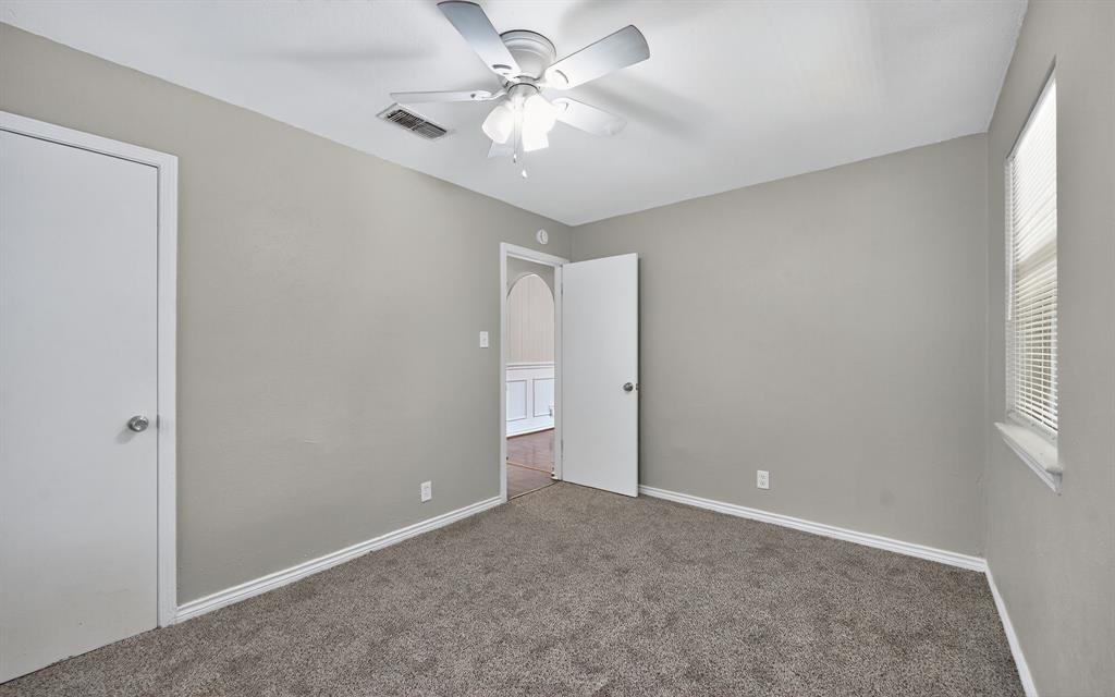 220 Short Street Burleson, TX 76028 - Photo 29 of 36 a view of a room with a ceiling fan and a window