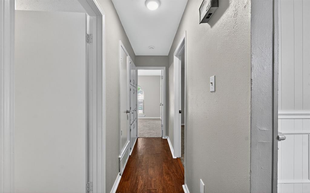 220 Short Street Burleson, TX 76028 - Photo 32 of 36 a view of a hallway with a hardwood floor