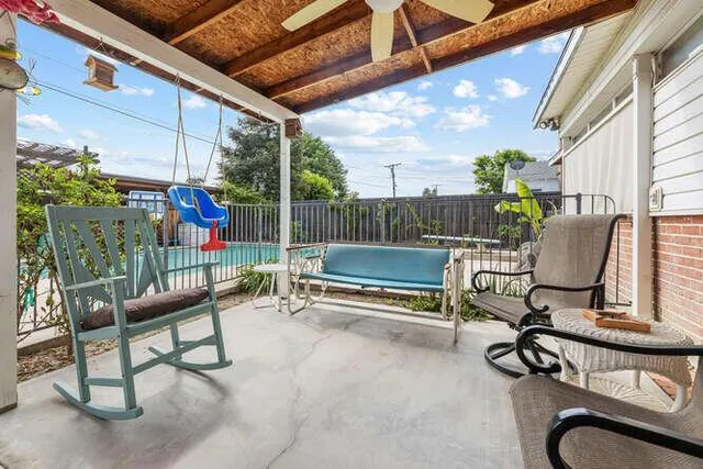 a view of a chairs and bench in the balcony