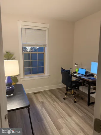 a workspace with furniture and a window