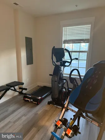 a room with gym equipment and a window