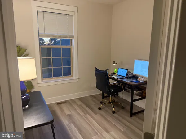 a workspace with furniture and a window