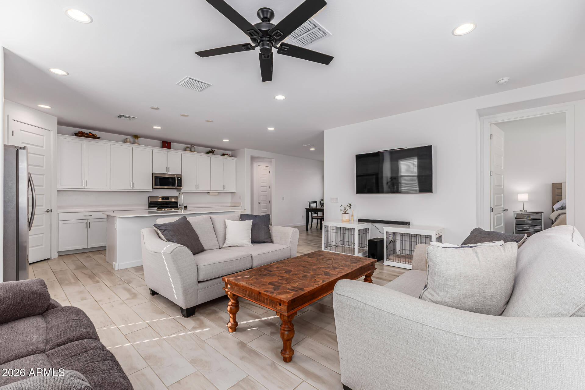 3347 South 156th Avenue Goodyear, AZ 85338 - Photo 10 of 50 a living room with furniture and a flat screen tv