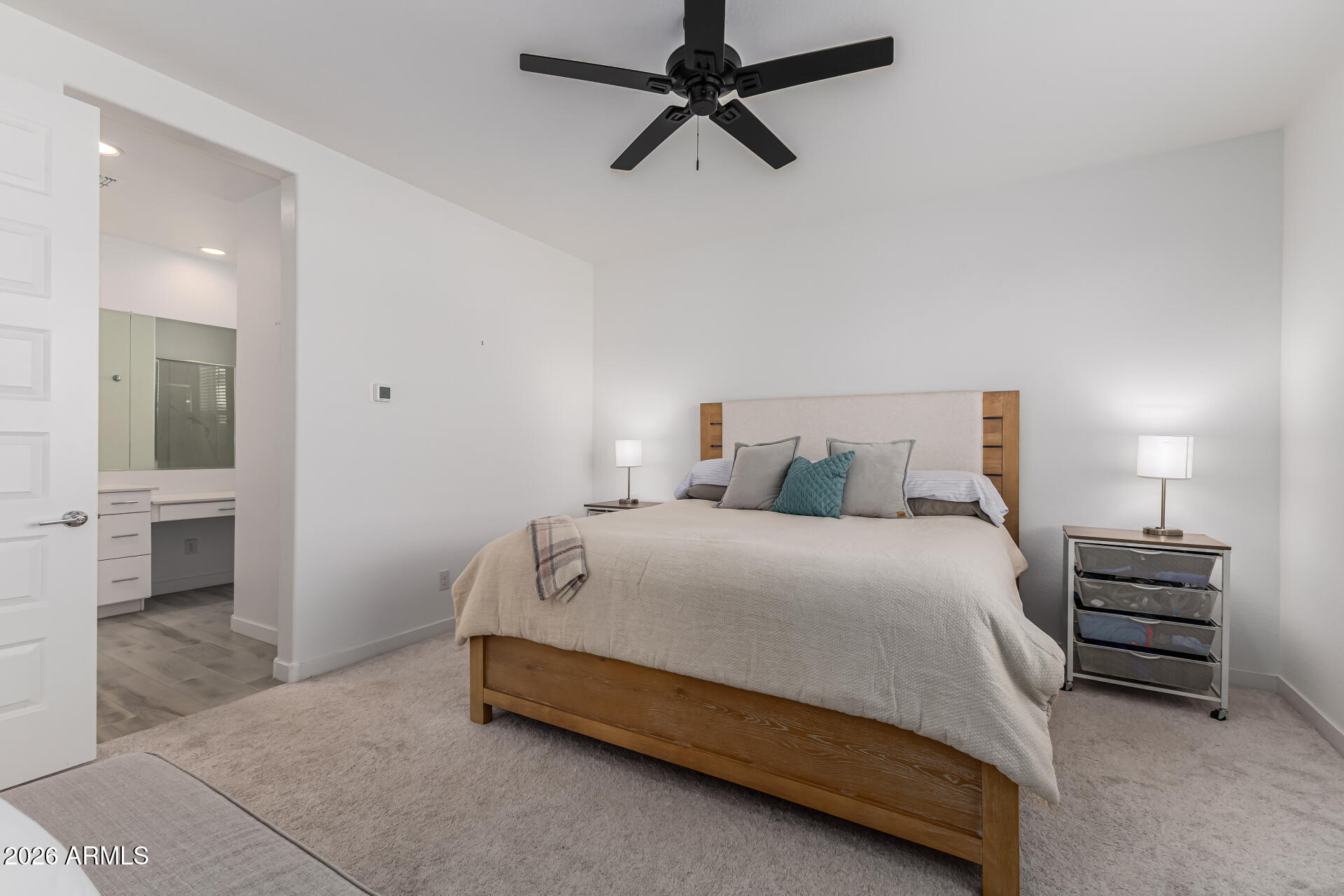 3347 South 156th Avenue Goodyear, AZ 85338 - Photo 19 of 50 a bedroom with a bed and a walk in closet