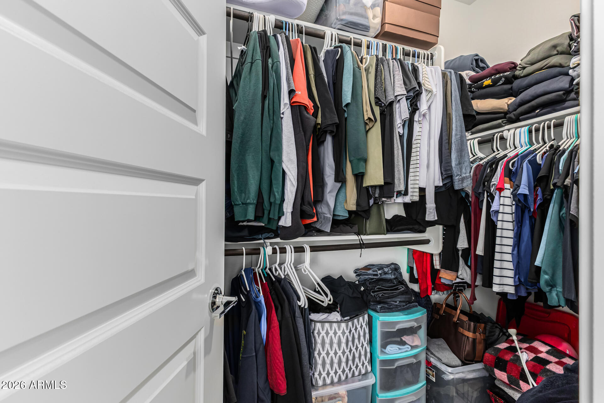 3347 South 156th Avenue Goodyear, AZ 85338 - Photo 23 of 50 a view of walk in closet with clothes