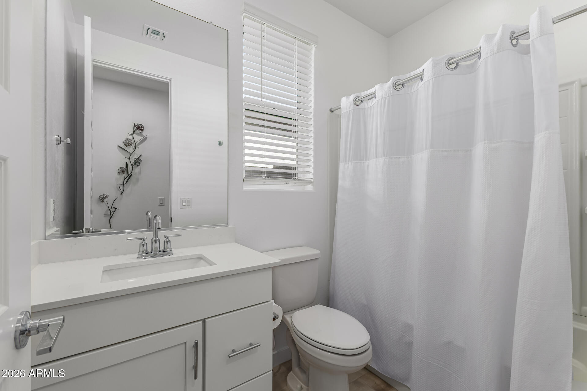 3347 South 156th Avenue Goodyear, AZ 85338 - Photo 26 of 50 a bathroom with a sink a toilet and shower