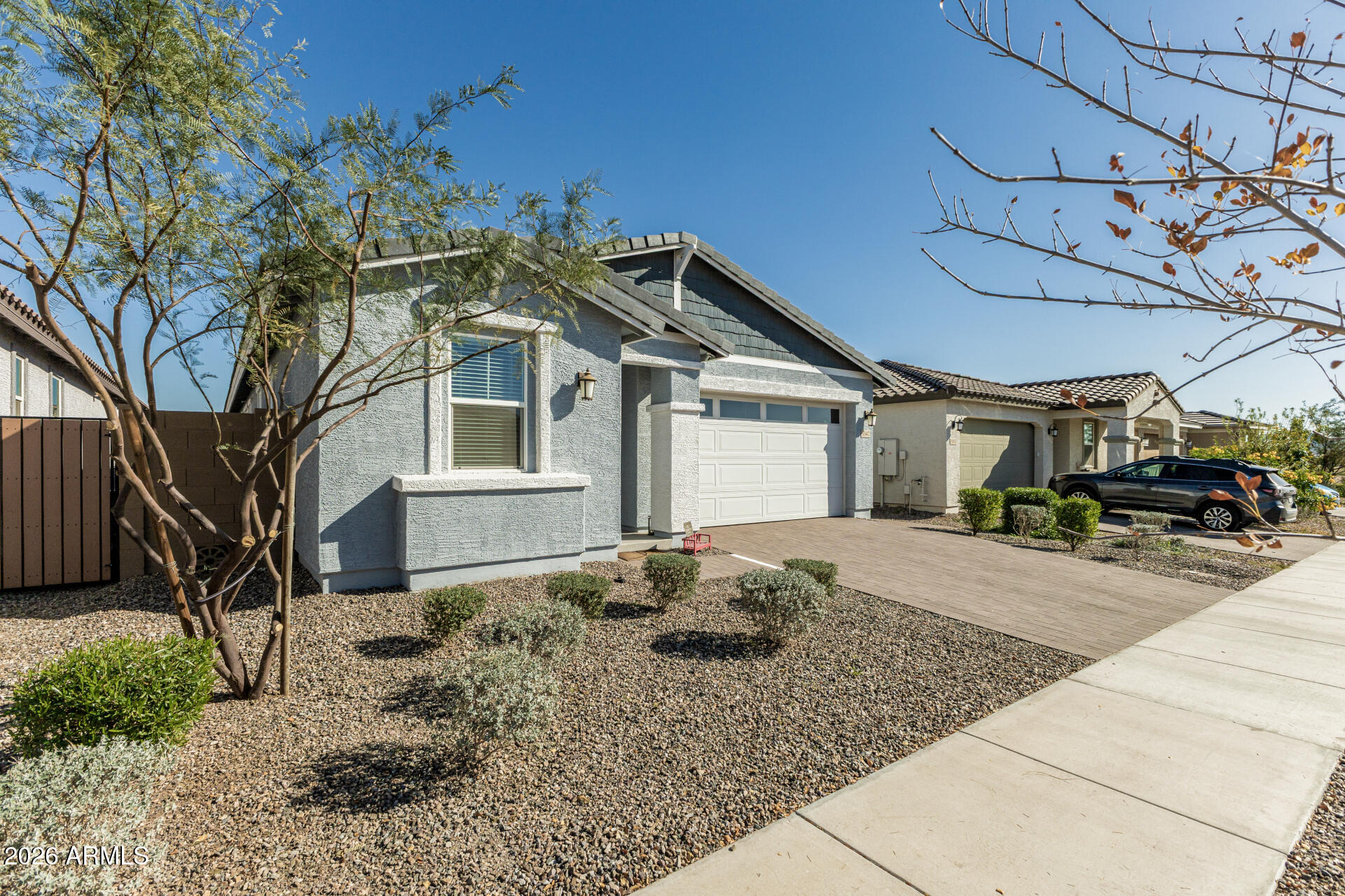 3347 South 156th Avenue Goodyear, AZ 85338 - Photo 49 of 50 a front view of a house with garden