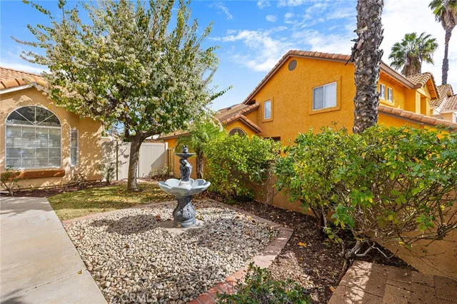 a dining room with furniture and chandelier
