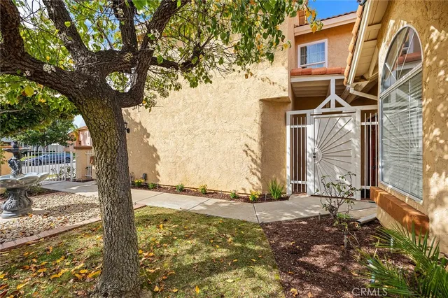 a dining room with furniture a chandelier and fireplace
