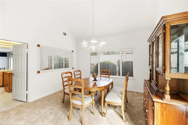 a kitchen with stainless steel appliances granite countertop a refrigerator a stove and a sink with cabinets