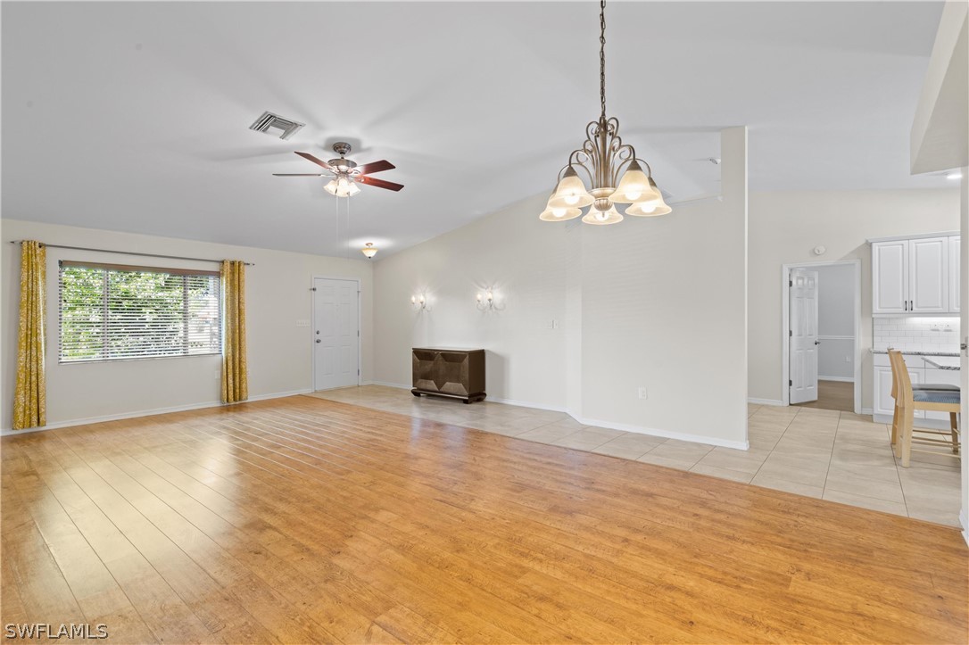 18205 Useppa Road Fort Myers, FL 33967 - Photo 3 of 27 a view of an empty room with a window and wooden floor
