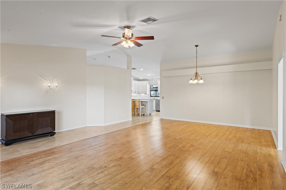 18205 Useppa Road Fort Myers, FL 33967 - Photo 8 of 27 a view of an empty room with a window and wooden floor
