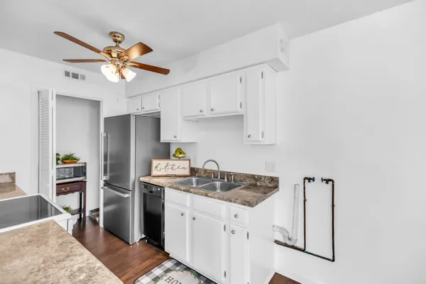a view of a hallway with wooden shelves