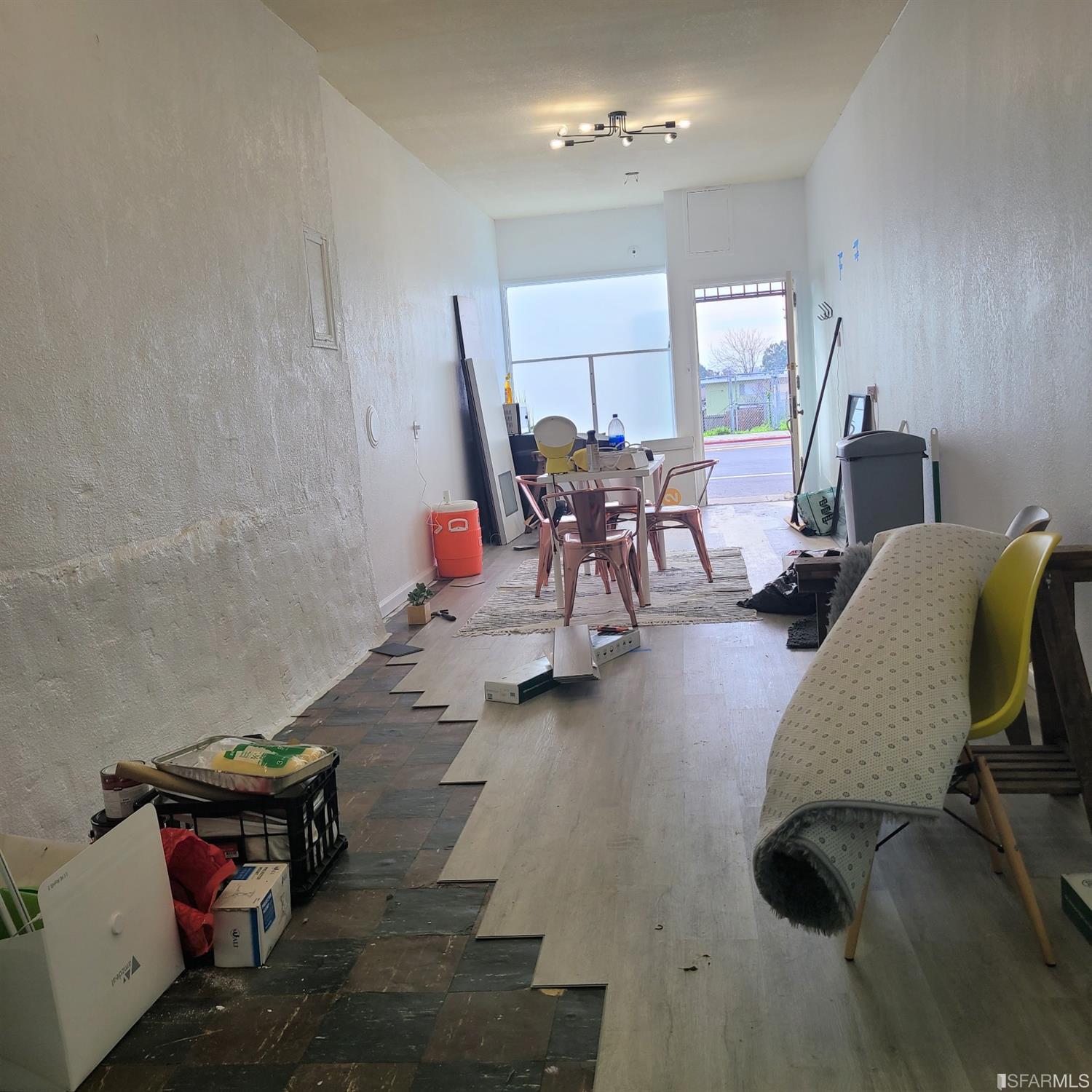 7960 MacArthur Boulevard Oakland, CA 94605 - Photo 7 of 10 a living room with furniture and a chandelier