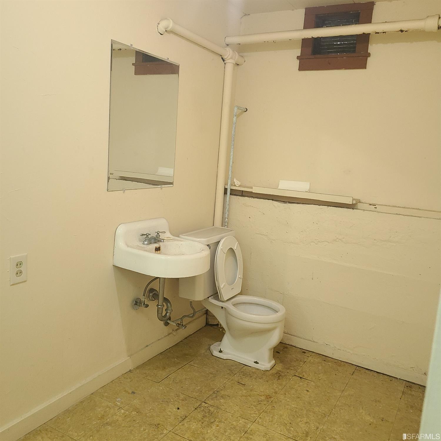 7960 MacArthur Boulevard Oakland, CA 94605 - Photo 10 of 10 a bathroom with a sink toilet and shower
