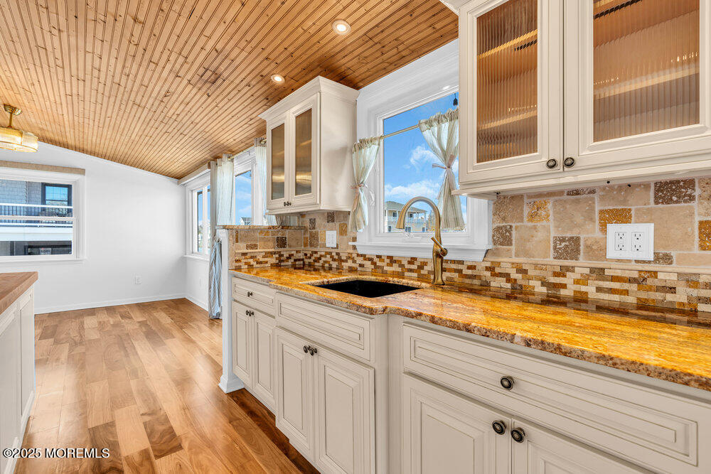 23 Bayview Drive Waretown, NJ 08758 - Photo 13 of 67 a view of a kitchen with granite countertop a sink and a stove