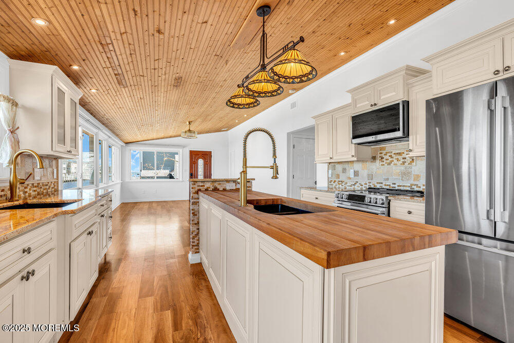23 Bayview Drive Waretown, NJ 08758 - Photo 14 of 67 a kitchen with stainless steel appliances granite countertop a sink and cabinets