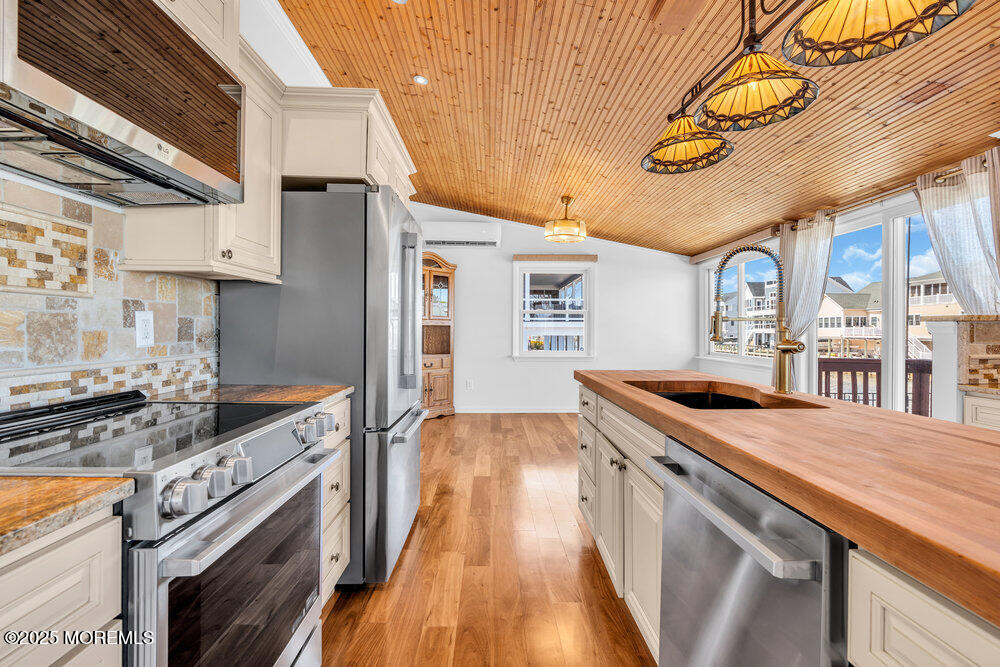 23 Bayview Drive Waretown, NJ 08758 - Photo 20 of 67 a kitchen with a stove and a wooden floors