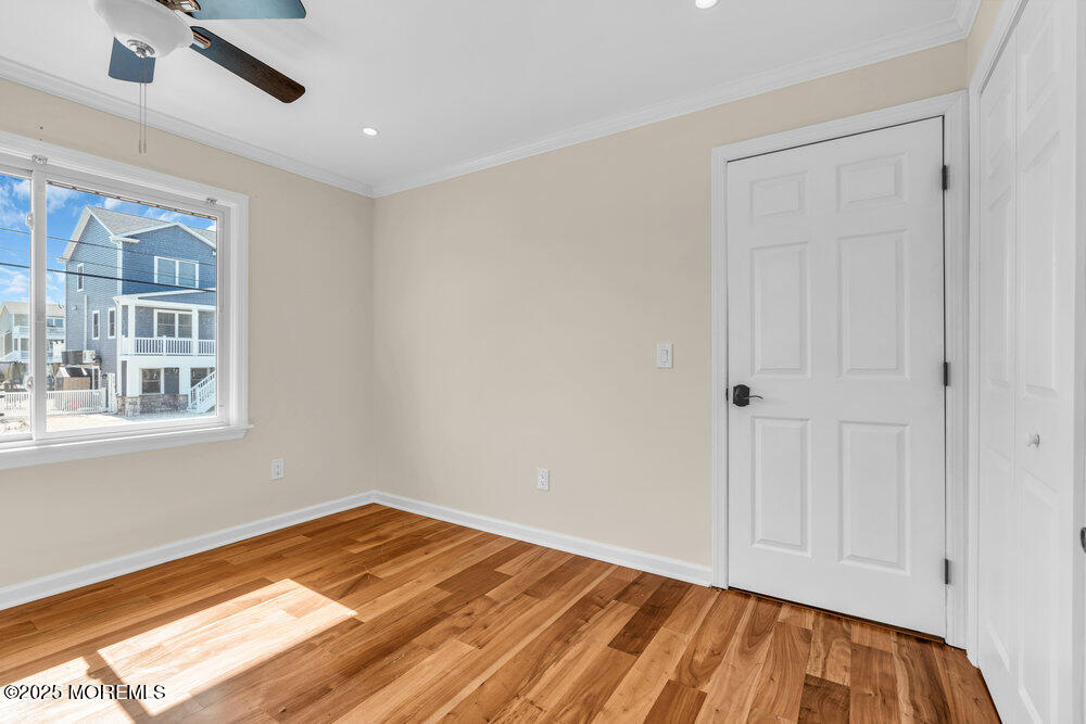 23 Bayview Drive Waretown, NJ 08758 - Photo 30 of 67 a view of empty room with wooden floor and fan