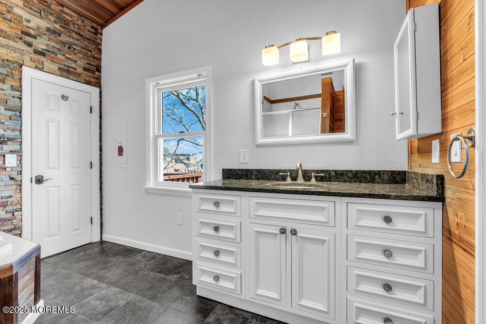 23 Bayview Drive Waretown, NJ 08758 - Photo 36 of 67 a bathroom with a sink and a mirror