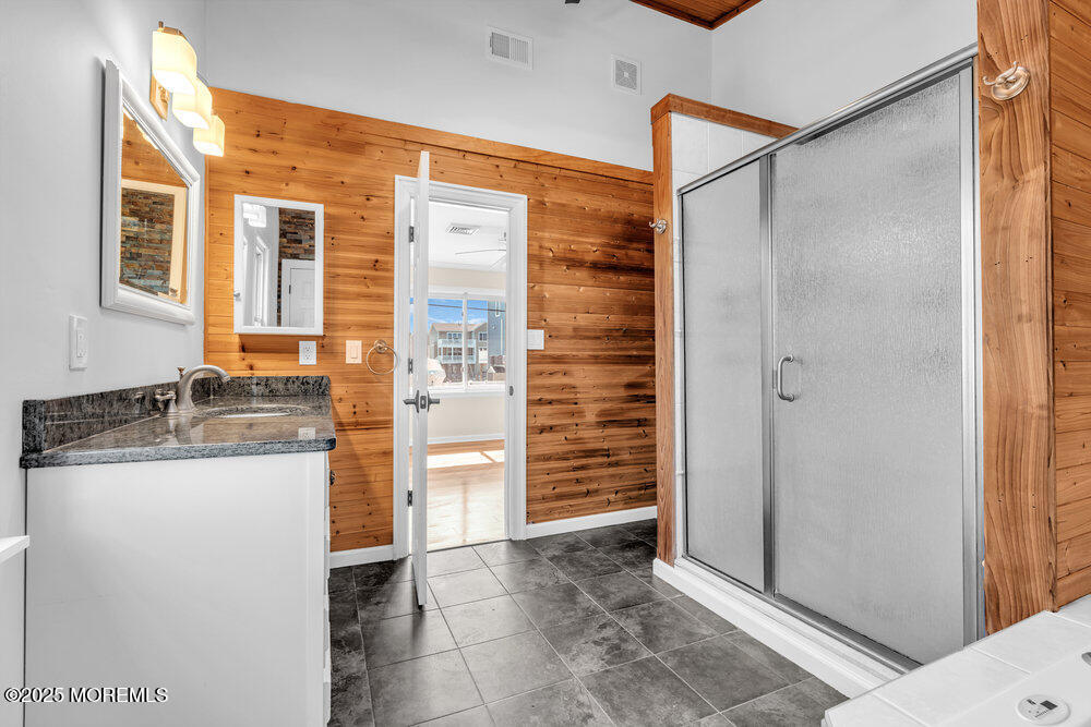 23 Bayview Drive Waretown, NJ 08758 - Photo 37 of 67 a bathroom with a granite countertop shower and a sink