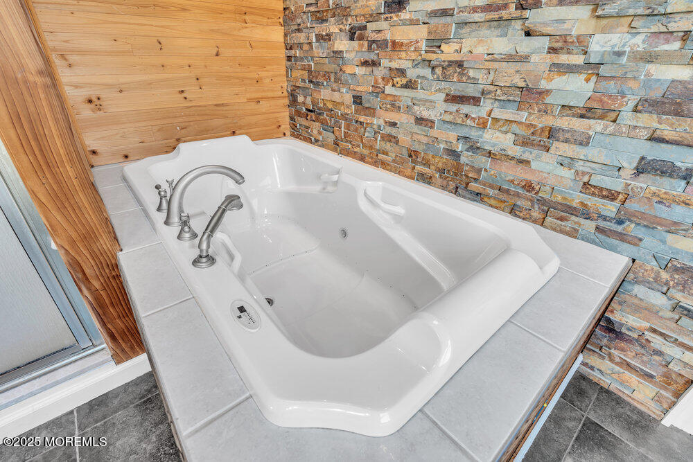 23 Bayview Drive Waretown, NJ 08758 - Photo 38 of 67 a bath tub sitting in a bathroom