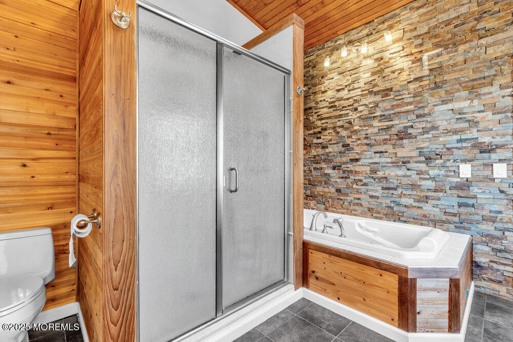 23 Bayview Drive Waretown, NJ 08758 - Photo 40 of 67 a bathroom with a shower and a sink